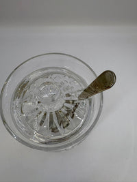Clear glass bowl with decorative interior design on a white background