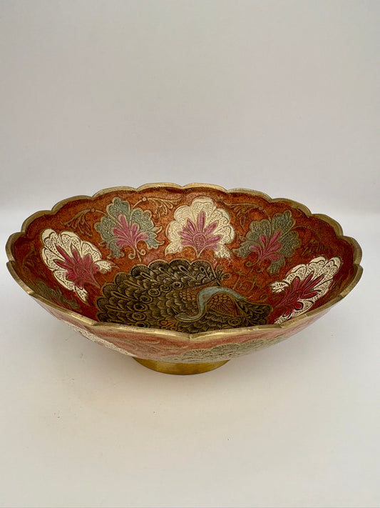 Decorative bowl with peacock design on a white background