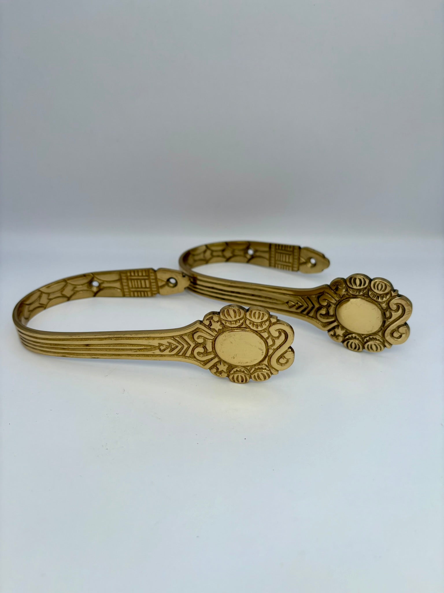 Solid brass curtain hardware set with vintage-style rods and finials