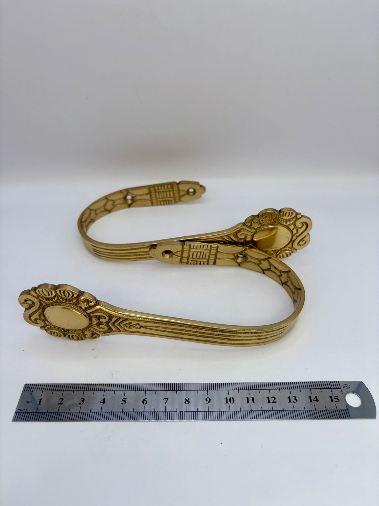 Solid brass curtain hardware set with vintage-style rods and finials