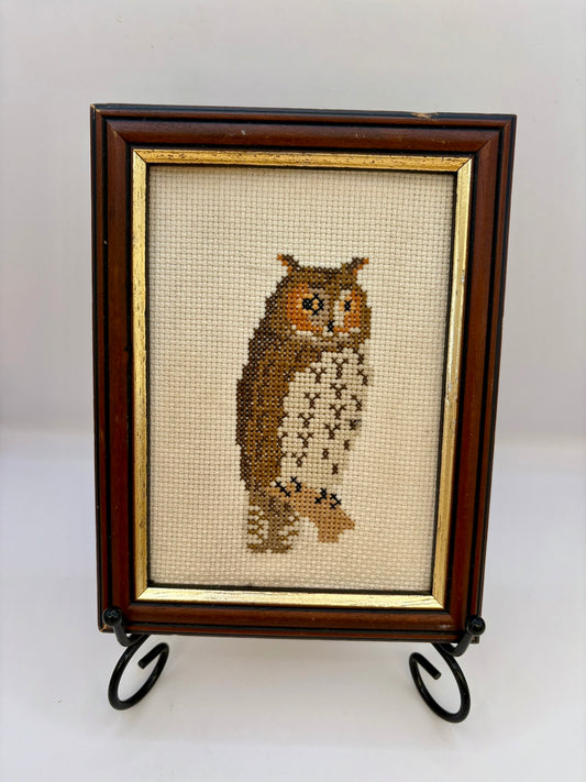 Framed cross-stitched owl on a white background