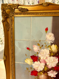 Decorative gold frame with floral painting on a floral background