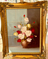 Decorative painting of flowers in a gold frame