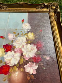 Floral painting in a gold frame