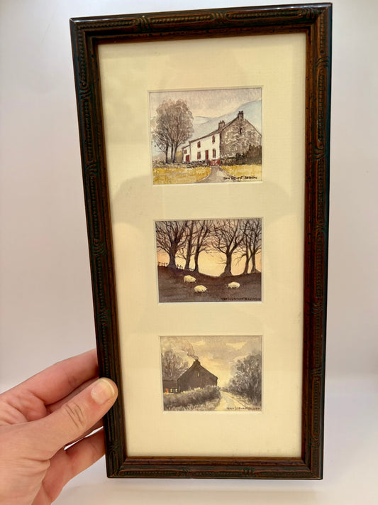 Framed artwork with three landscape illustrations on a white background