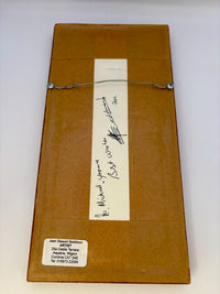 Brown back picture with a signature on a white background