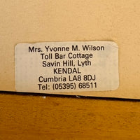 Address label on a wooden surface