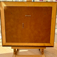Back view of a wooden picture with visible hardware