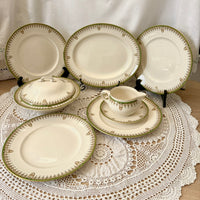 Set of ceramic plates and a pitcher on a lace tablecloth