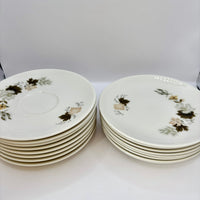Set of ceramic plates with floral design on a white background