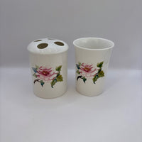 Two ceramic items with floral designs on a white background