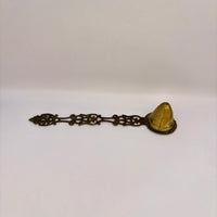 Antique 1960s brass candle snuffer with elegant vintage design