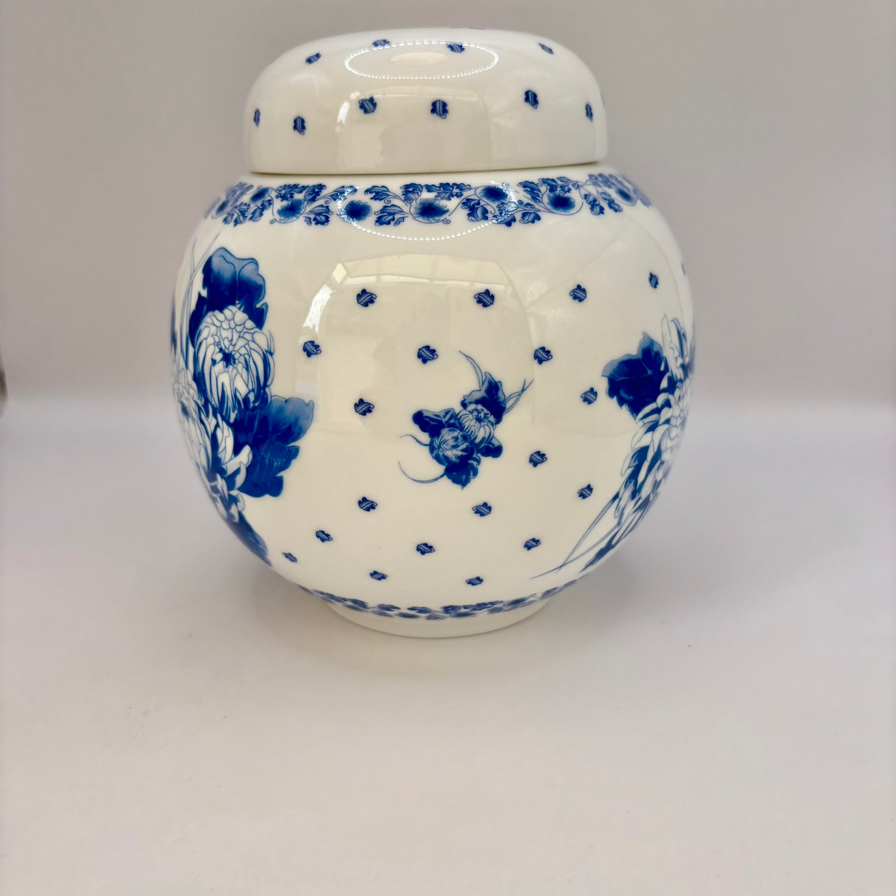 Vintage Ringtons bone china ginger jar with blue and white chrysanthemum design and lid