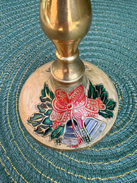 Decorative object with floral design on a textured green surface