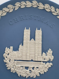 Decorative plate with Westminster Abbey and 'Christmas' text on a blue background