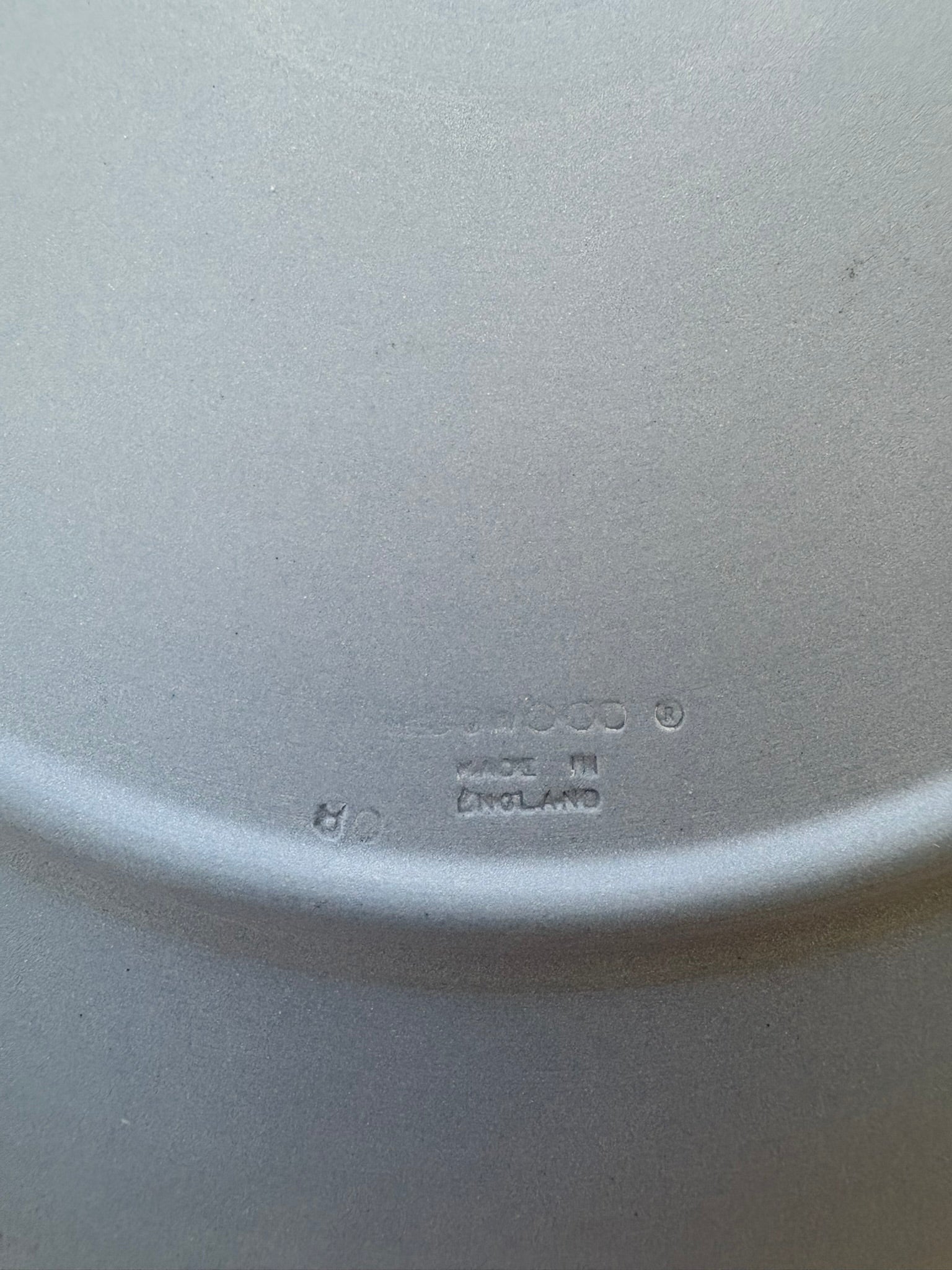 Close-up of a white ceramic plate with 'Ceramic' and 'Made in England' text.