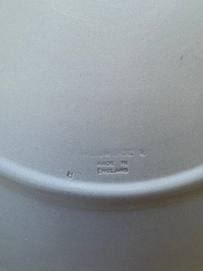 Close-up of a white ceramic plate with 'Ceramic' and 'Made in England' text.