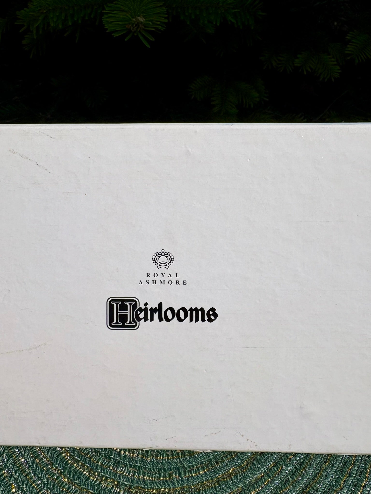 White box with 'Royal Ashmore Heirlooms' branding on a dark background
