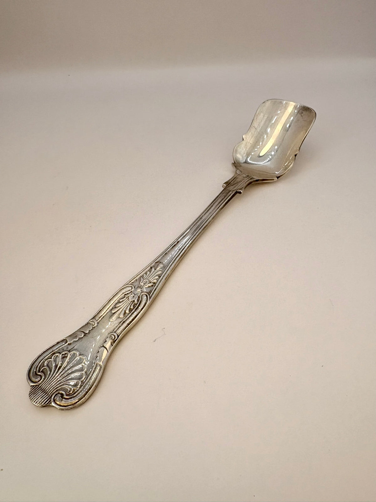 Silver spoon on a white background