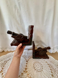 Pair of vintage wooden cannon bookends with metal brackets for bookshelf decor