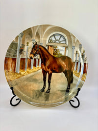Decorative plate with a horse in a stable design on a white background