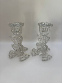 Two crystal candle holders on a white background