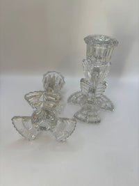 Set of clear glass candle holders on a white background