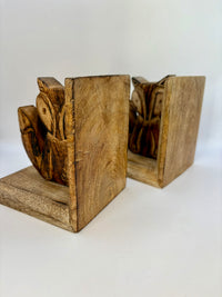 Wooden bookends with a natural finish on a white background