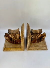 Wooden bookends with fox design on a white background