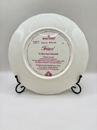 White decorative plate with text on a gray background