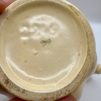 Close-up of a ceramic bowl with a textured surface