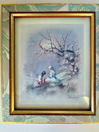 Framed artwork of two people under a cherry blossom tree