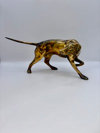 Bronze statue of a dog on a white background