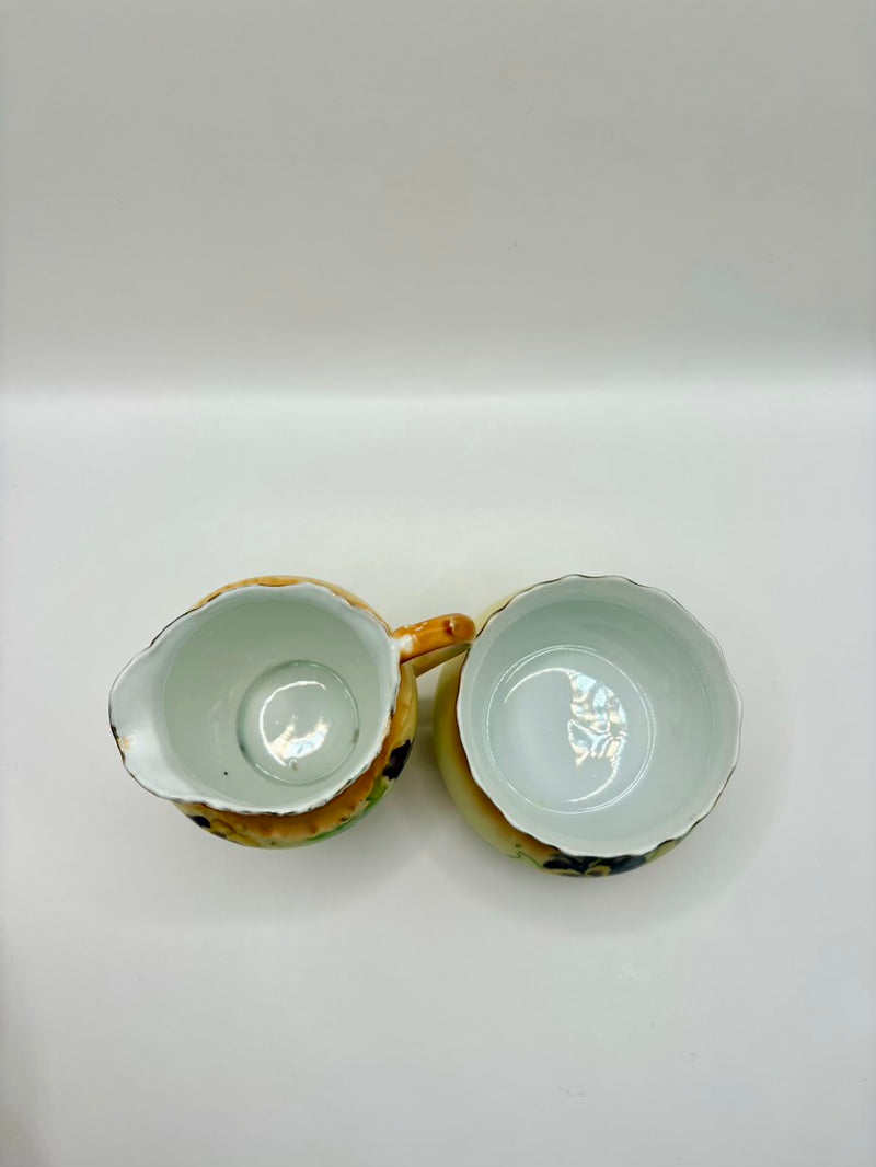 Two ceramic bowls with a decorative edge on a white background
