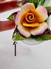 Decorative flower made of food on a white plate with a blurred background