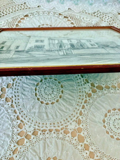 Close-up of a lace doily with intricate patterns on a textured surface.