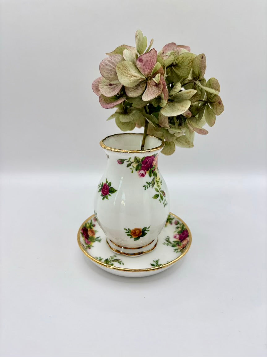 Decorative vase with floral design on a white background