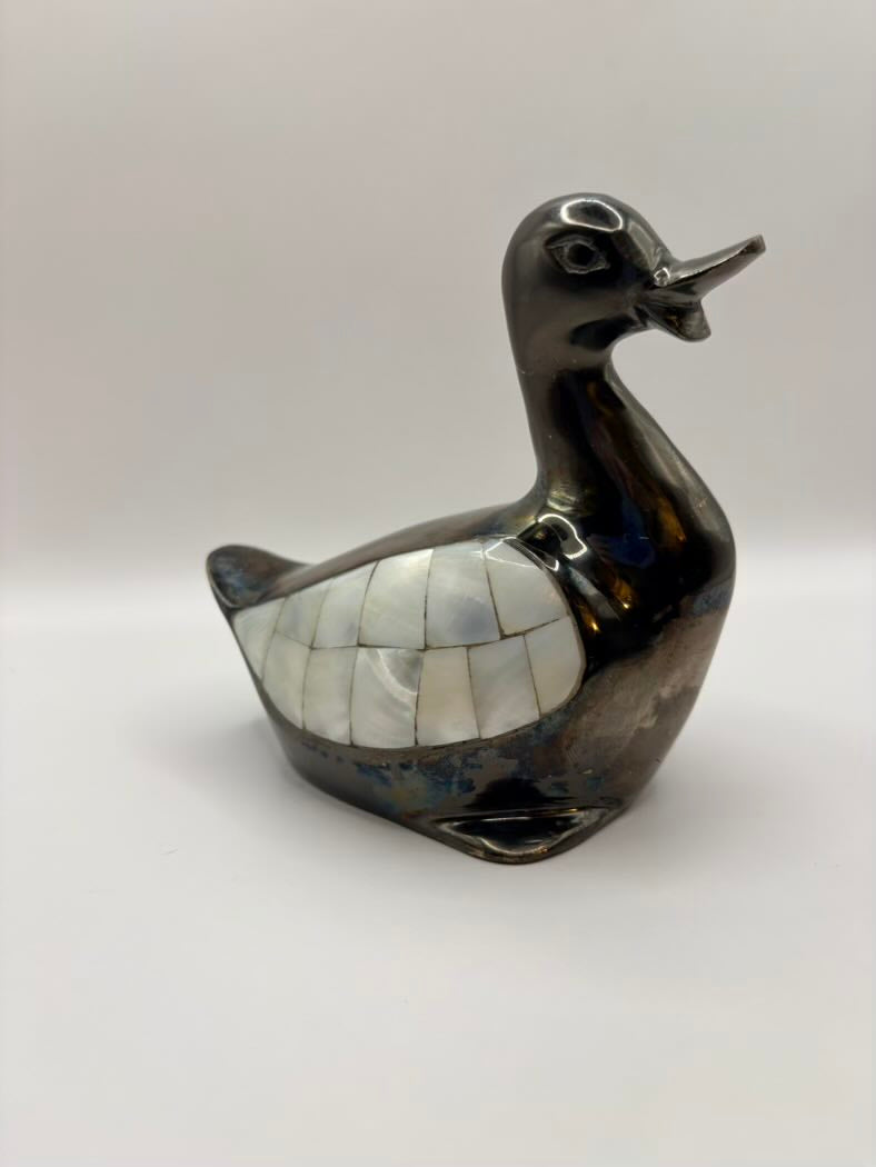 Decorative duck sculpture with mosaic pattern on a white background