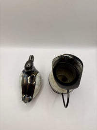 Black ceramic teapot with a horse head spout on a white background