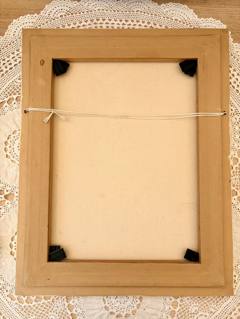 Wooden picture frame on a lace background