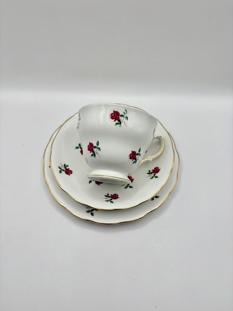 Teacup and saucer set with floral design on a white background
