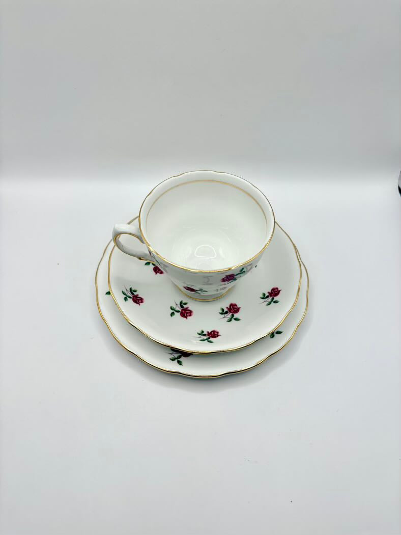 Teacup and saucers with floral design on a white background