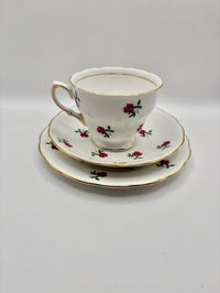 Teacup and saucers with floral design on a white background