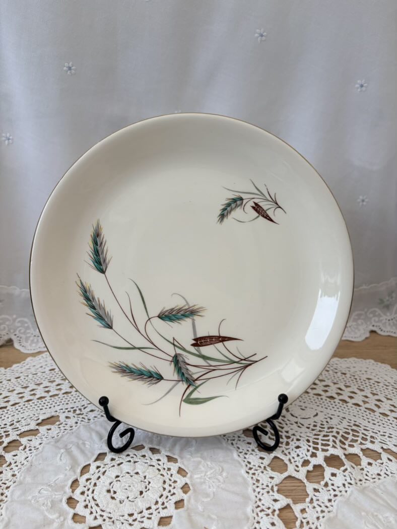 Decorative plate with nature-themed design on a lace tablecloth