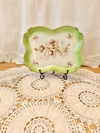 Decorative plate with floral design on a lace doily