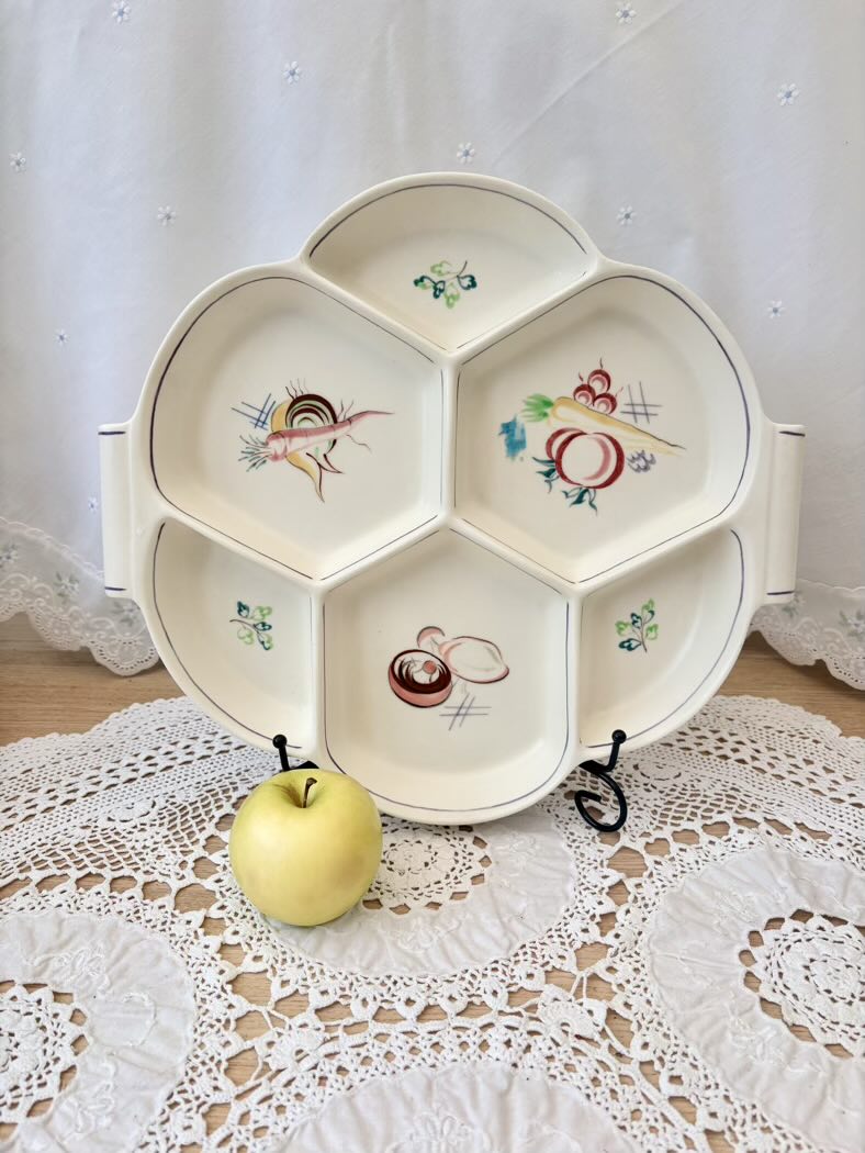 Decorative plate with cartoon designs on a lace tablecloth