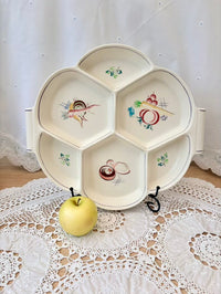 Decorative plate with cartoon designs on a lace tablecloth
