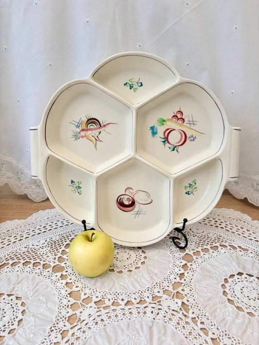 Decorative plate with cartoon designs on a lace tablecloth