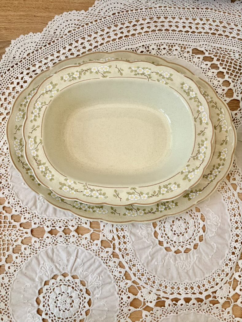 Set of ceramic plates on a lace doily