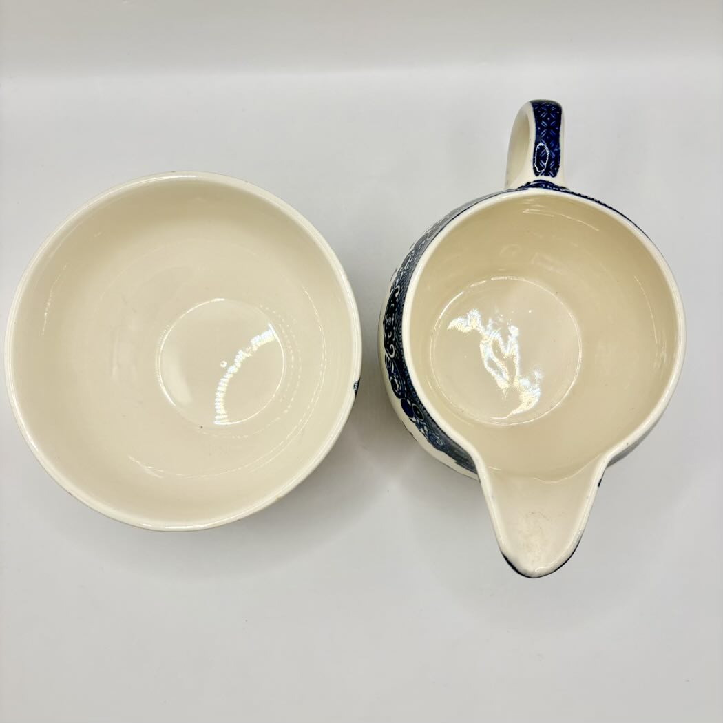 Ceramic bowl and pitcher on a white background